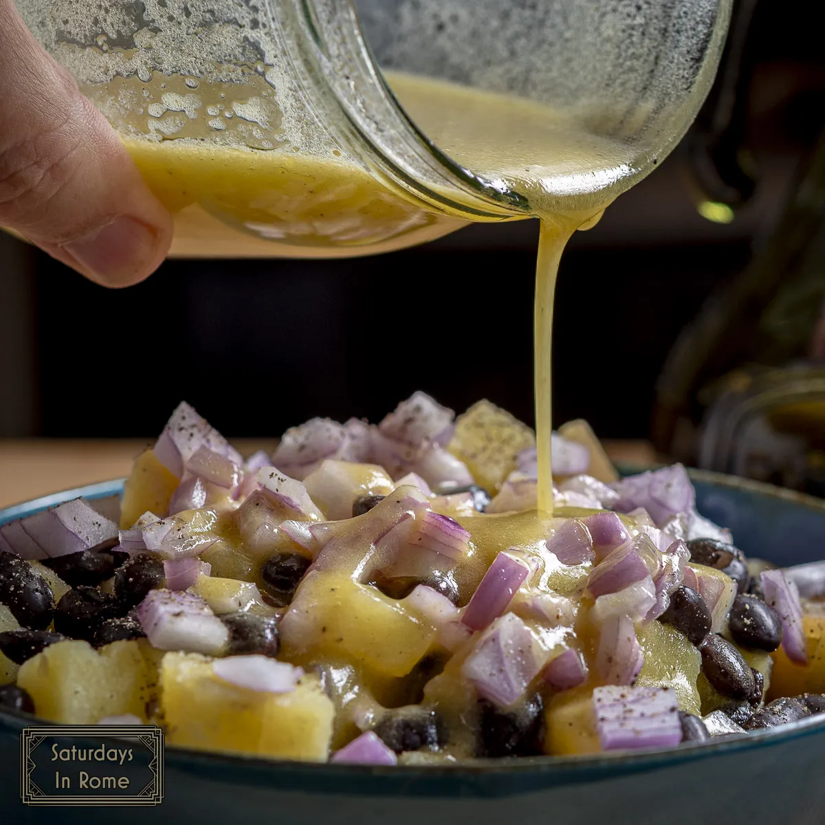 bean and potato salad - pouring the dressing